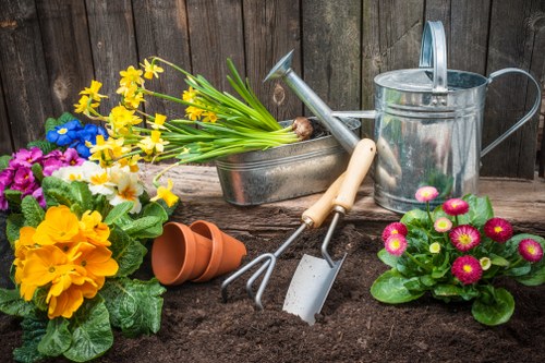 Gardener using PPE and safe technique during landscaping