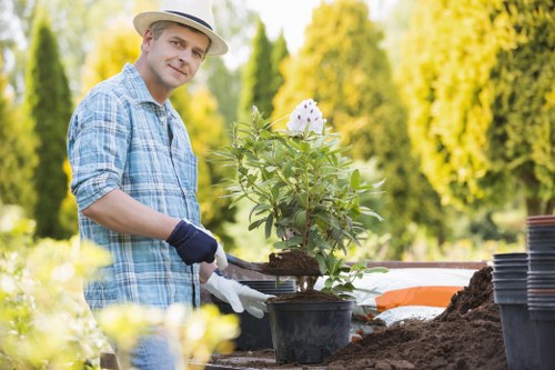 Training session for gardeners demonstrating safe equipment use